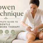 Bowen Technique therapy session showing a practitioner applying gentle hands-on bodywork to a relaxed client on a massage table in a calm wellness setting.